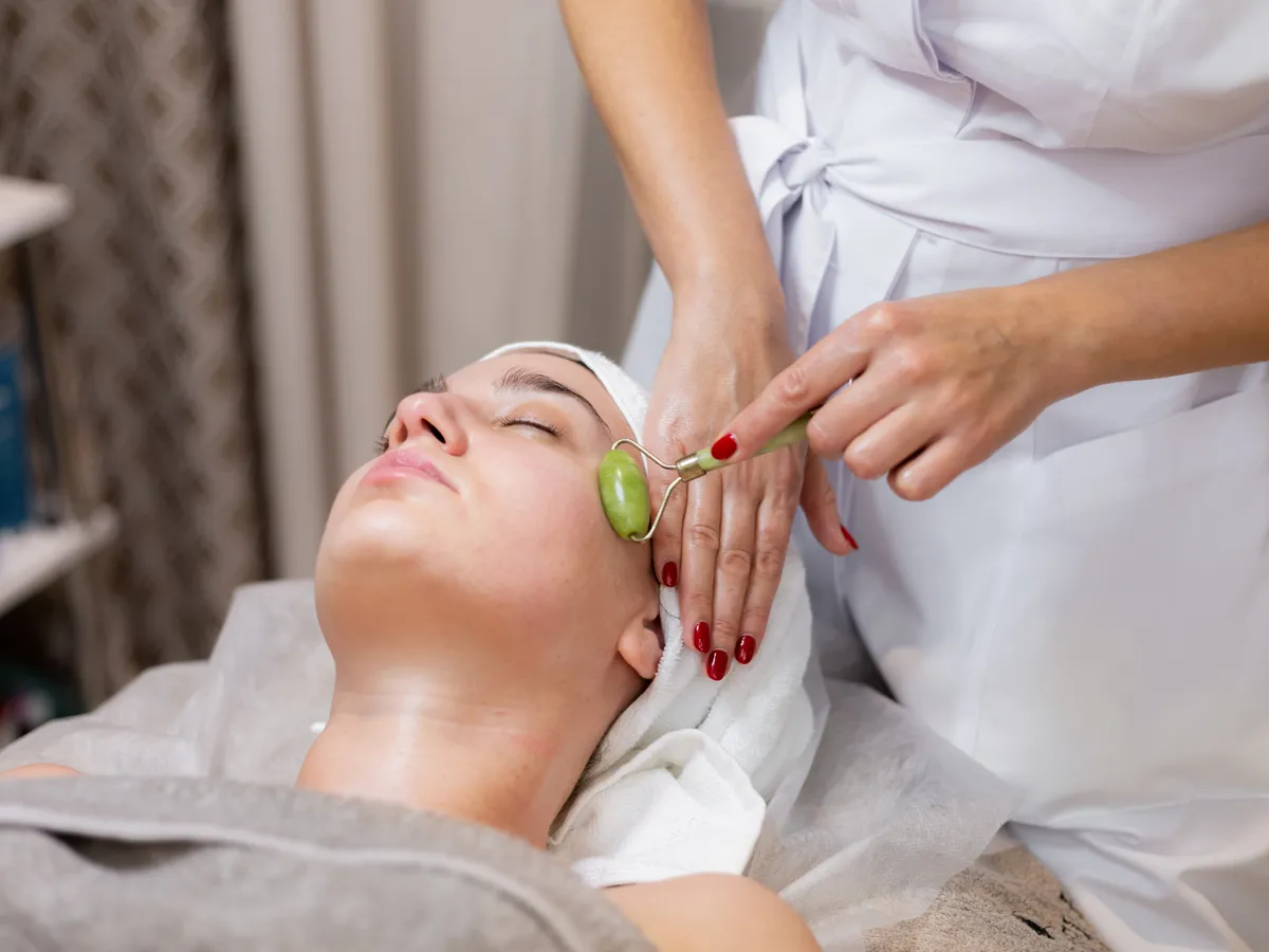 A client relaxing during a facial treatment